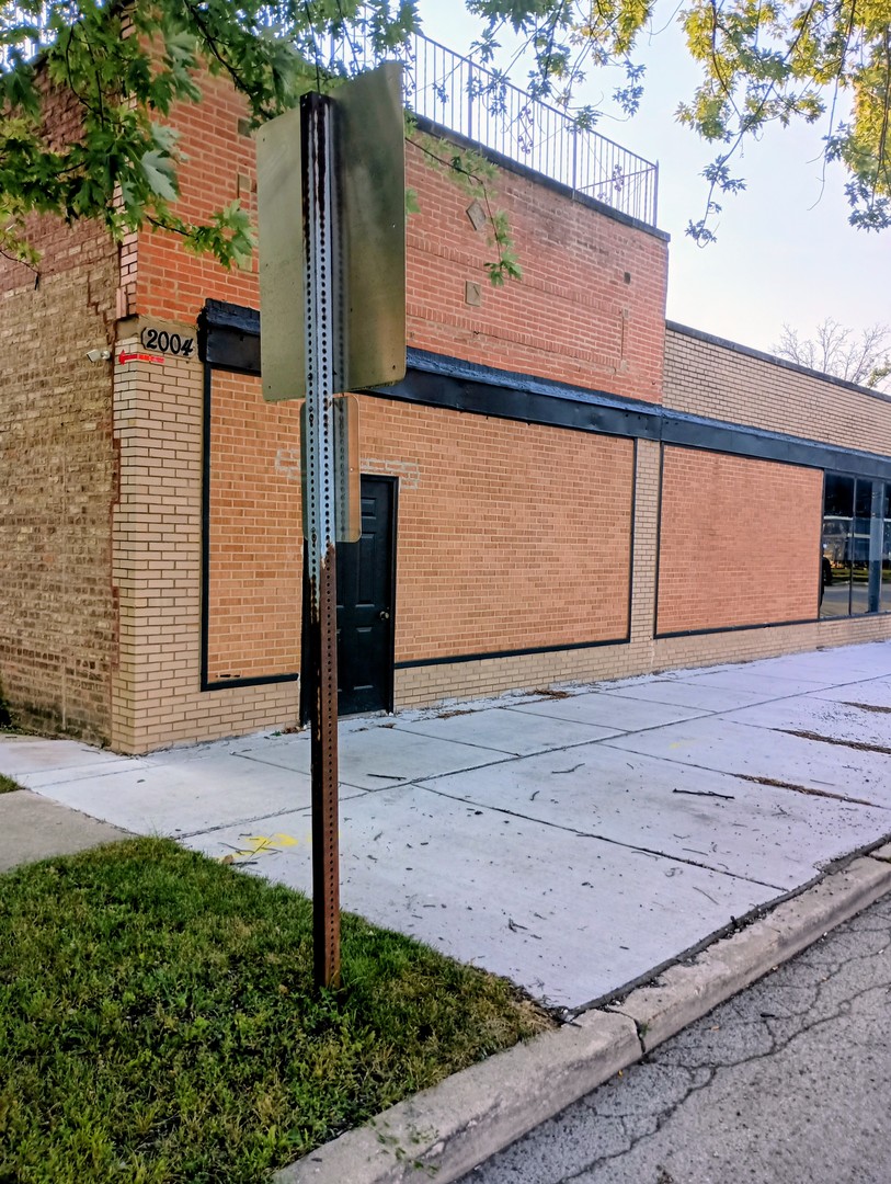 2000-04 South 17th Avenue Broadview, IL 60155 - Photo 2 of 7 a sign board on the side of the road