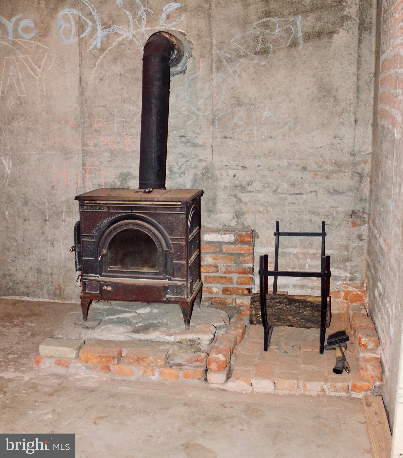 116 Rouzer Lane Thurmont, MD 21788 - Photo 15 of 19 Woodstove in basement