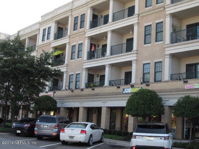1661 Riverside Avenue, Unit 307 Jacksonville, FL 32204 - Photo 22 of 24 a view of building with car parked