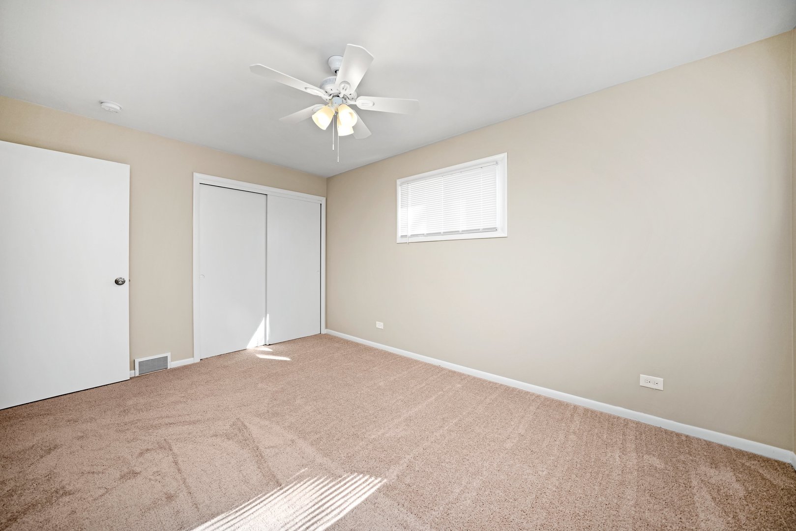 609 Delles Road Wheaton, IL 60187 - Photo 14 of 28 a view of an empty room with a chandelier fan