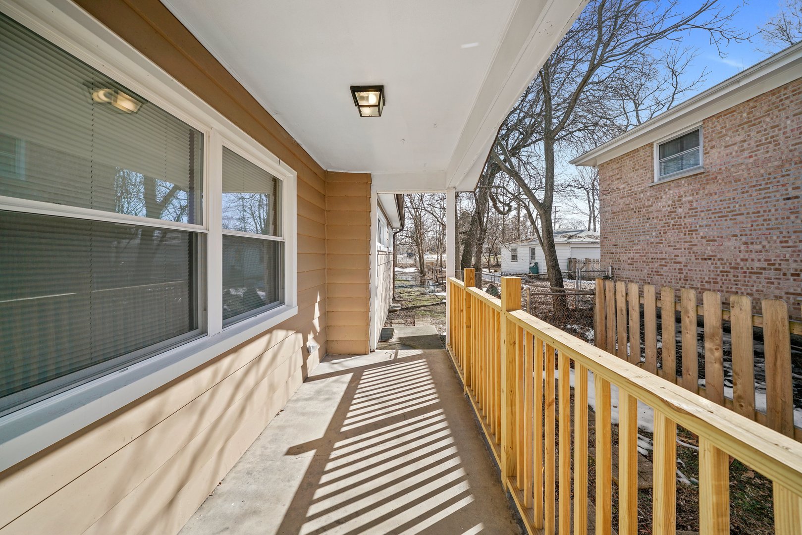 609 Delles Road Wheaton, IL 60187 - Photo 23 of 28 a view of a balcony with wooden floor