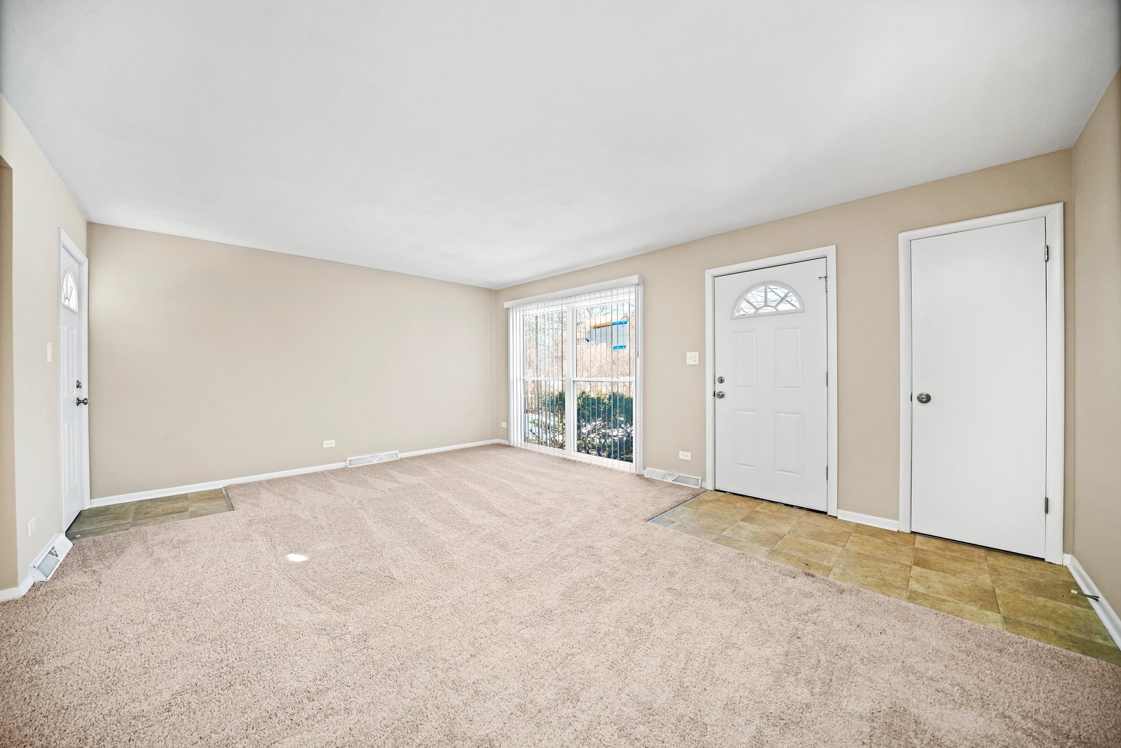 609 Delles Road Wheaton, IL 60187 - Photo 4 of 28 a view of an empty room with a window