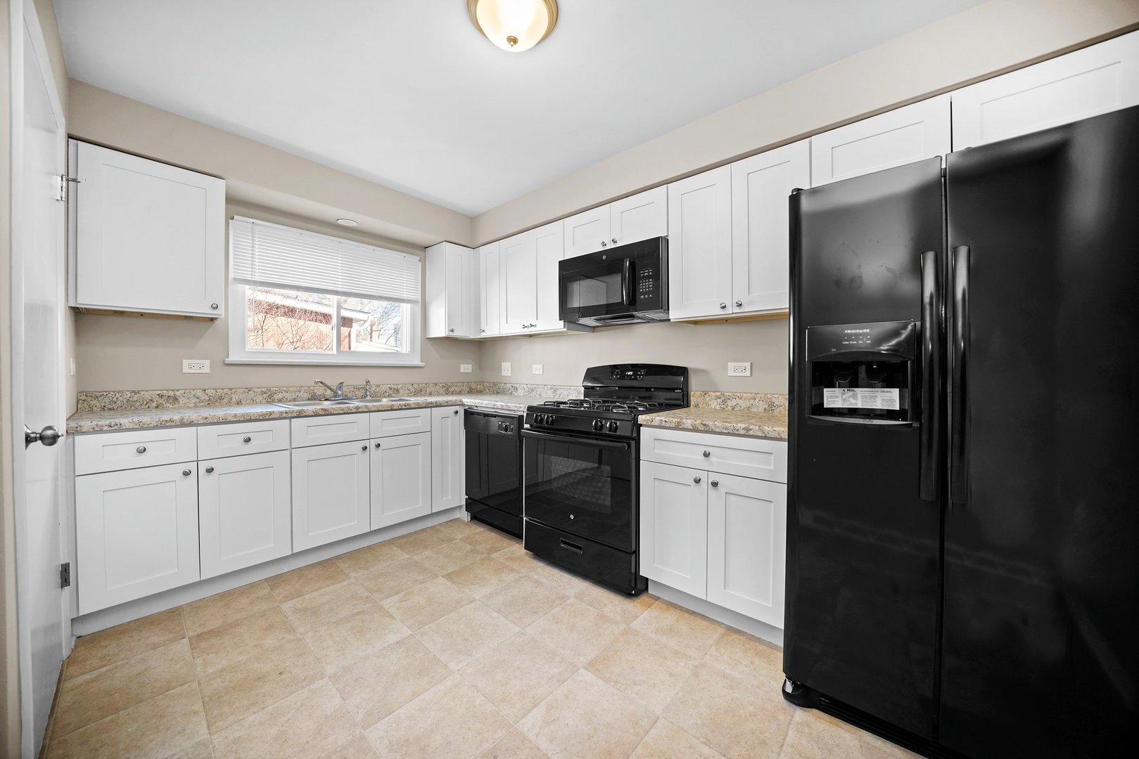609 Delles Road Wheaton, IL 60187 - Photo 7 of 28 a kitchen with a refrigerator stove and microwave