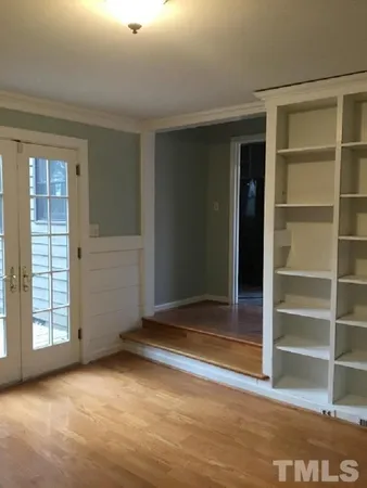 a view of a dining room with furniture and window