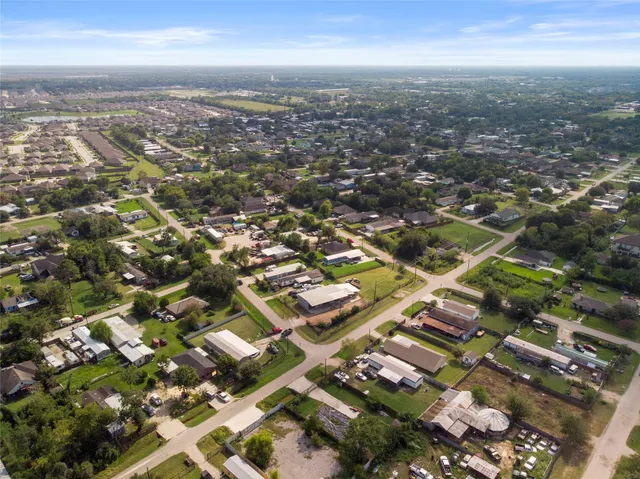 an aerial view of residential building with parking