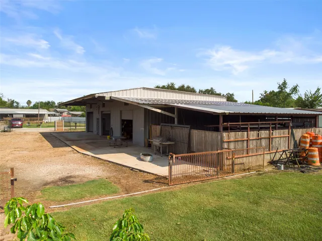 a view of yard with swimming pool and green space