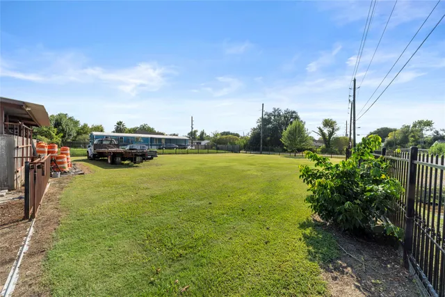 a view of a swimming pool and lounge chairs
