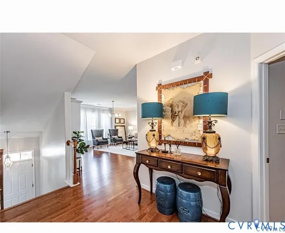 a view of living room with furniture and wooden floor