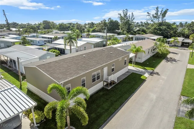 aerial view of a house with a yard
