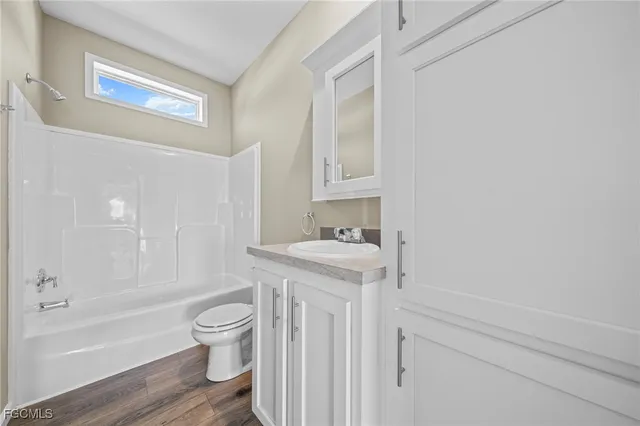 a bathroom with a sink a toilet and a bathtub