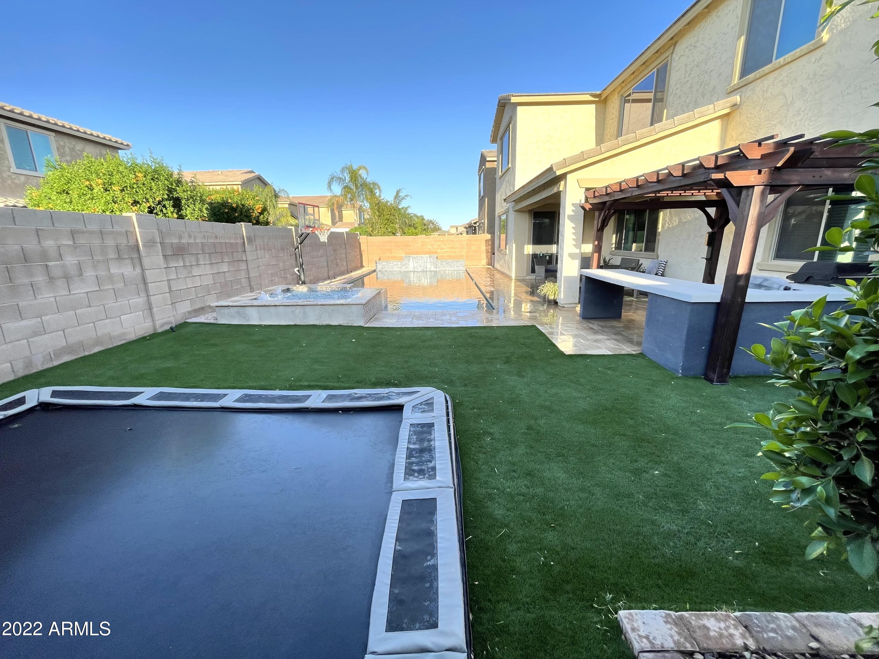 20060 Rosa Road Queen Creek, AZ 85142 - Photo 39 of 46 In Ground trampoline looking at pool