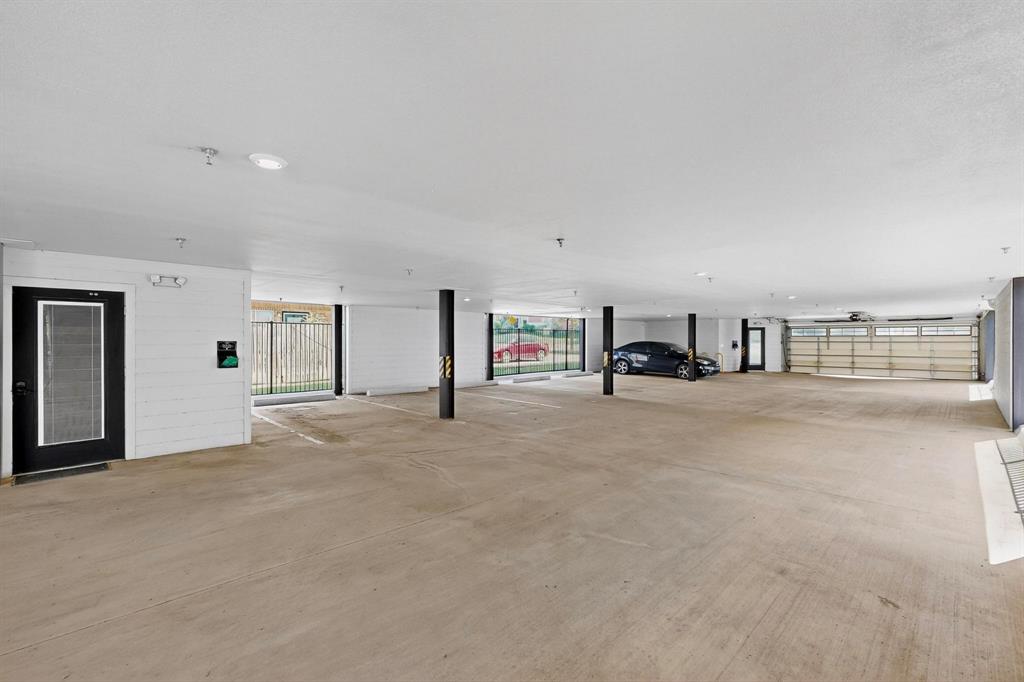800 South Welch Street, Unit 102 Denton, TX 76201 - Photo 14 of 15 a living room with furniture and a flat screen tv