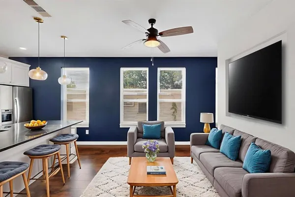 a living room with furniture and a flat screen tv