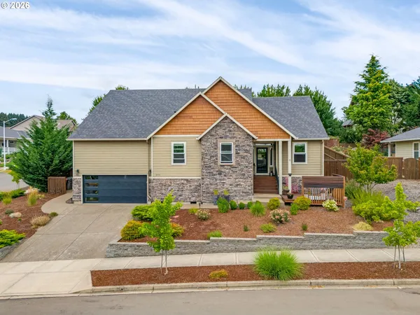 a front view of a house with a garden