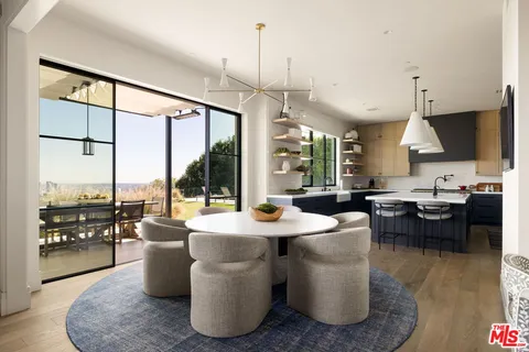 a bathroom with a sink and a large mirror