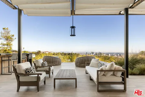a view of an outdoor space with furniture