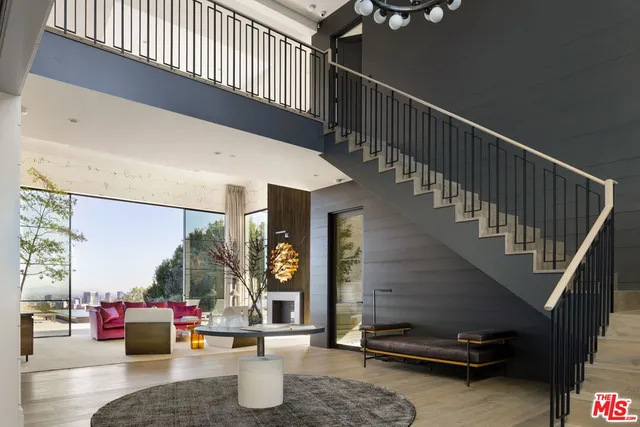 a dining room with furniture window and wooden floor