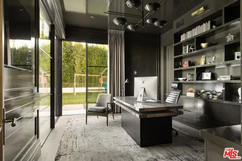 a bathroom with a sink mirror and window