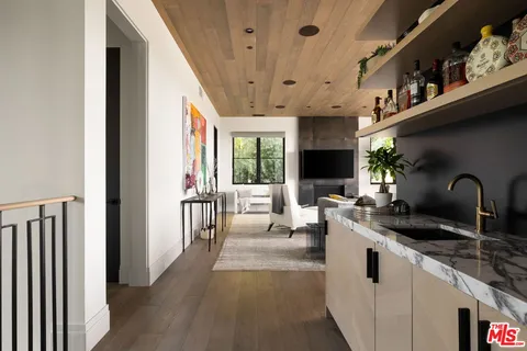 a living room with fireplace furniture and a flat screen tv