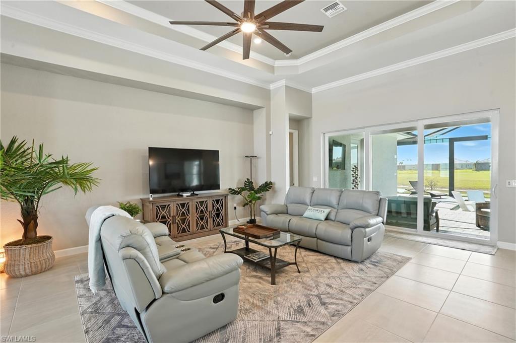 15027 Longs Lane Babcock Ranch, FL 33982 - Photo 13 of 50 a living room with furniture and a flat screen tv