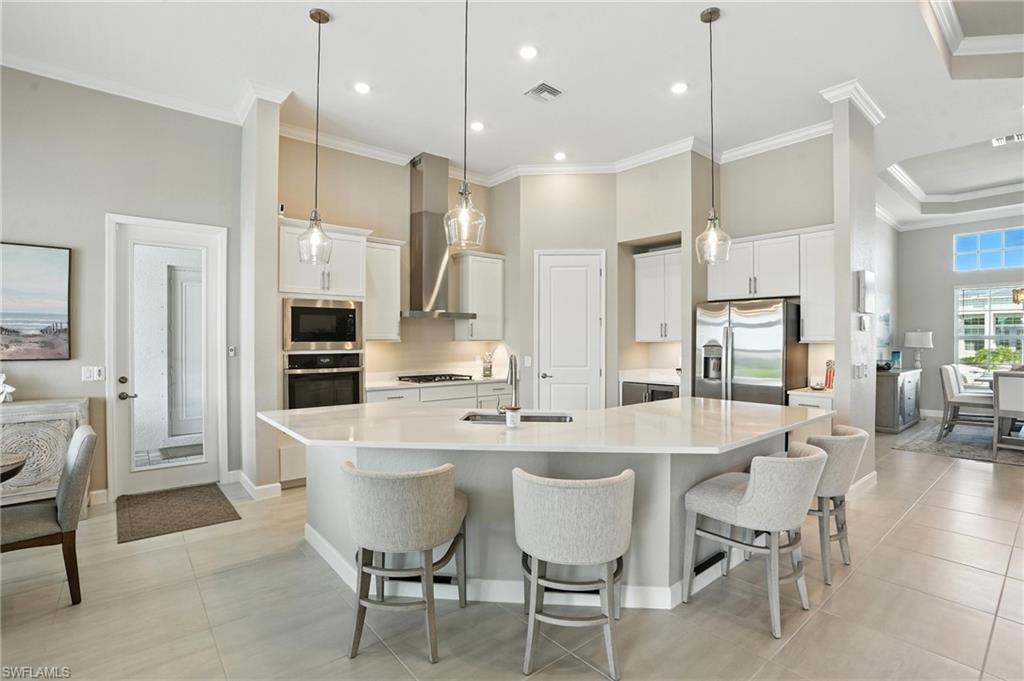 15027 Longs Lane Babcock Ranch, FL 33982 - Photo 15 of 50 a large kitchen with a table and chairs
