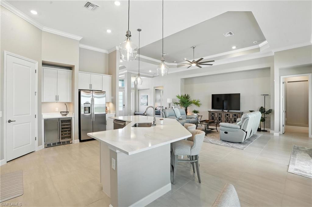 15027 Longs Lane Babcock Ranch, FL 33982 - Photo 16 of 50 a large kitchen with a table and chairs
