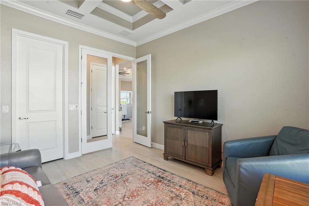 15027 Longs Lane Babcock Ranch, FL 33982 - Photo 23 of 50 a living room with furniture and a flat screen tv