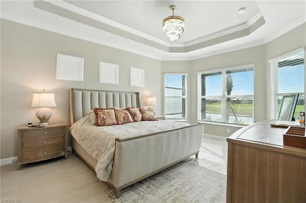 a bedroom with a bed and a tv