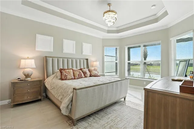 a bedroom with a bed and a tv