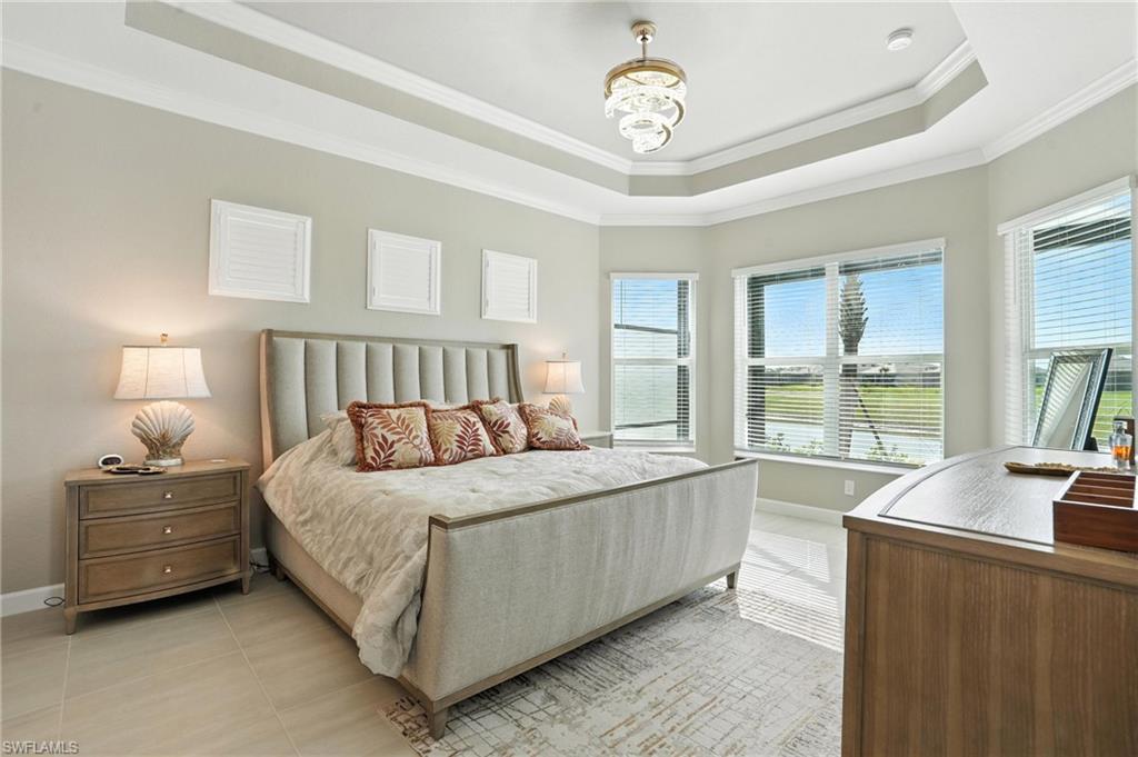 15027 Longs Lane Babcock Ranch, FL 33982 - Photo 24 of 50 a bedroom with a large bed and a large window