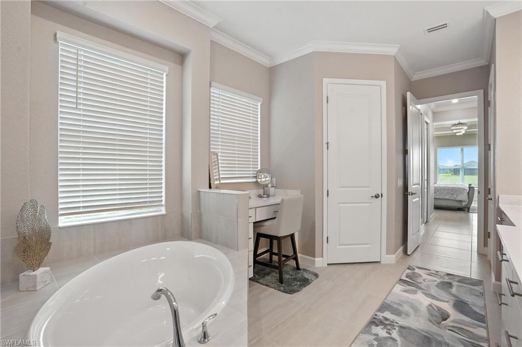 15027 Longs Lane Babcock Ranch, FL 33982 - Photo 28 of 50 a bathroom with a sink and a bathtub