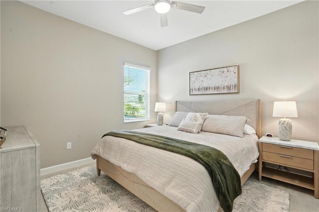 15027 Longs Lane Babcock Ranch, FL 33982 - Photo 36 of 50 a bedroom with a bed and a window