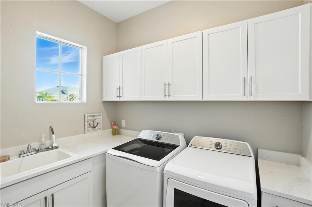 15027 Longs Lane Babcock Ranch, FL 33982 - Photo 39 of 50 a utility room with dryer and washer