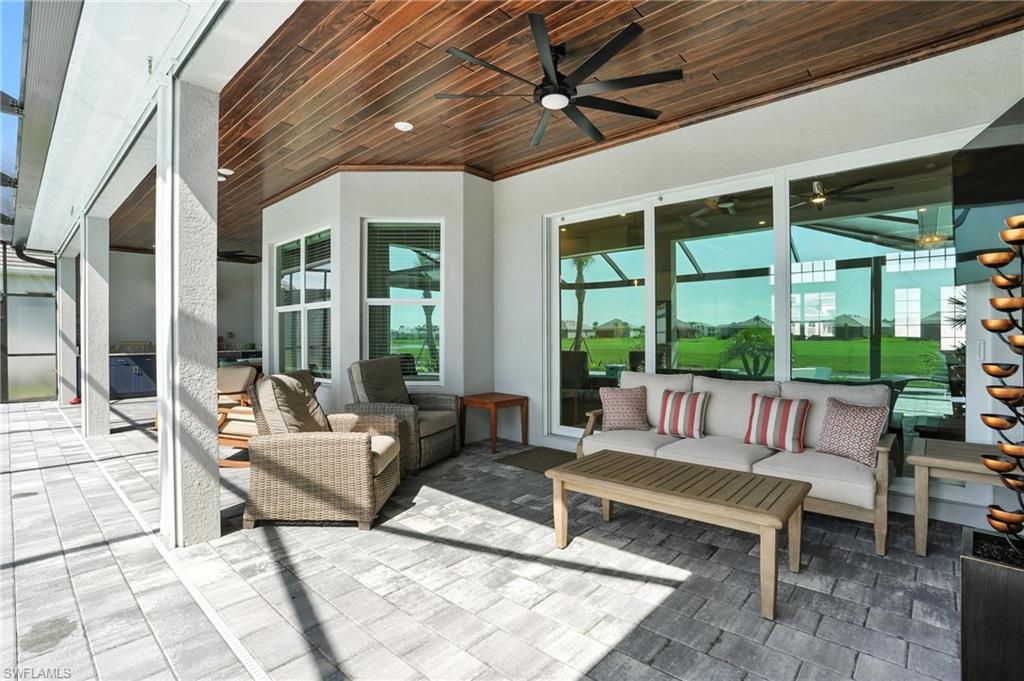 15027 Longs Lane Babcock Ranch, FL 33982 - Photo 42 of 50 a outdoor living space with furniture and a large window