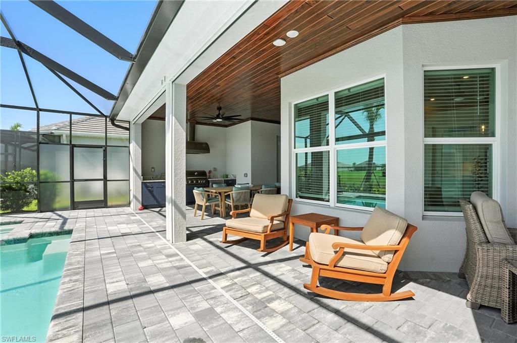 15027 Longs Lane Babcock Ranch, FL 33982 - Photo 44 of 50 a outdoor space with patio the couches and a dining table with the view of the balcony