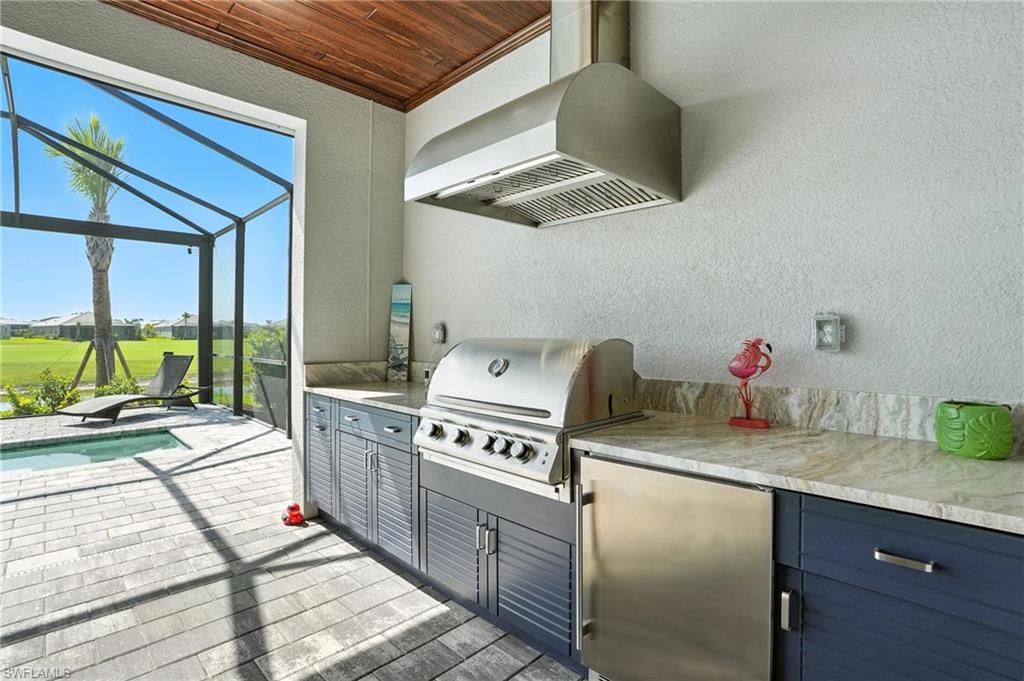 15027 Longs Lane Babcock Ranch, FL 33982 - Photo 45 of 50 a kitchen that has a stove and a white cabinets
