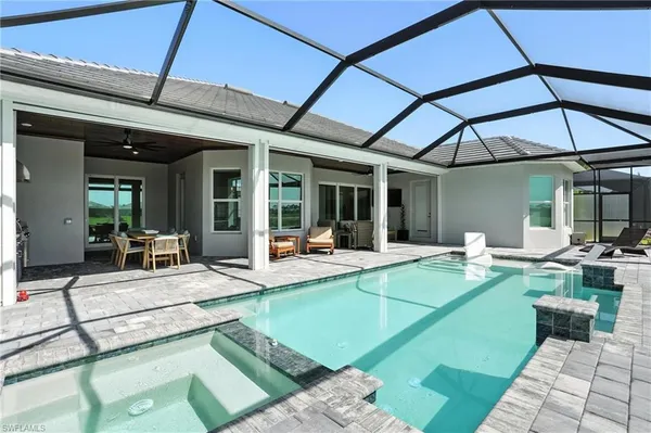 a view of swimming pool with a patio