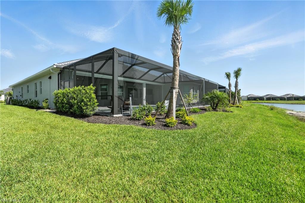 15027 Longs Lane Babcock Ranch, FL 33982 - Photo 50 of 50 a front view of a house with garden