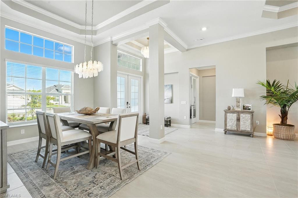 15027 Longs Lane Babcock Ranch, FL 33982 - Photo 7 of 50 a view of a dining room with furniture and a chandelier