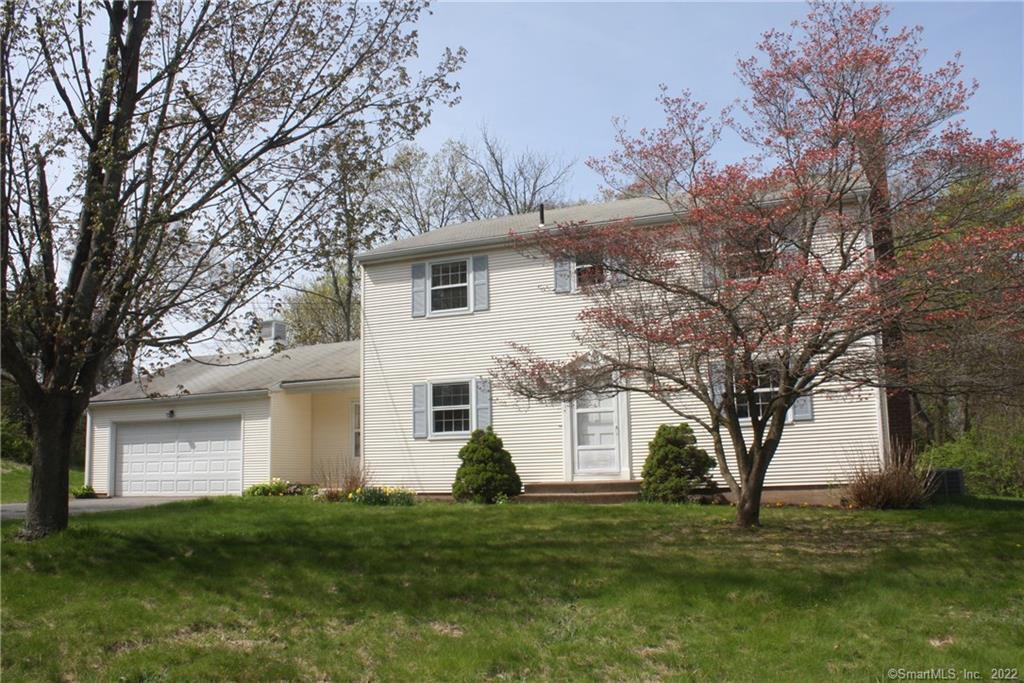 41 Farmington Street Manchester, CT 06042 - Photo 1 of 1 a front view of a house with a garden