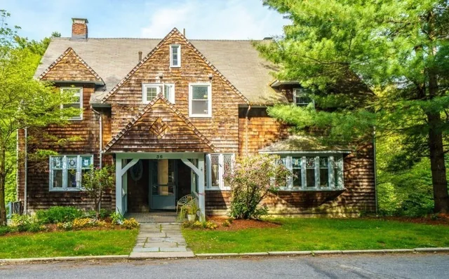 a front view of a house with a yard
