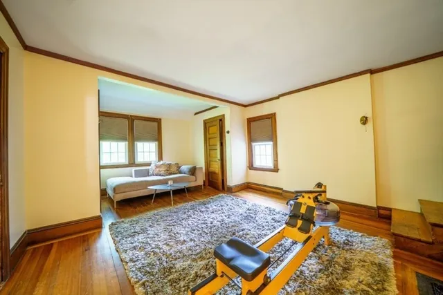 a bed room with furniture and window