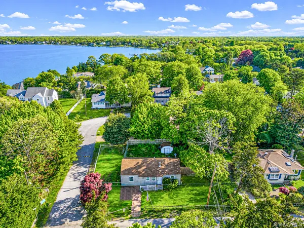 a view of a yard with a lake view