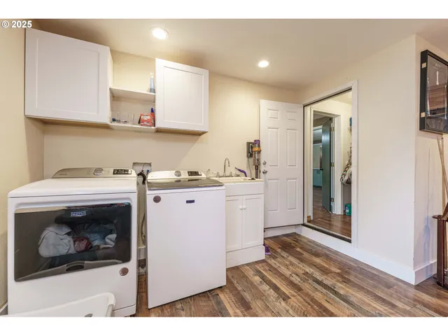 a kitchen with a refrigerator and cabinets