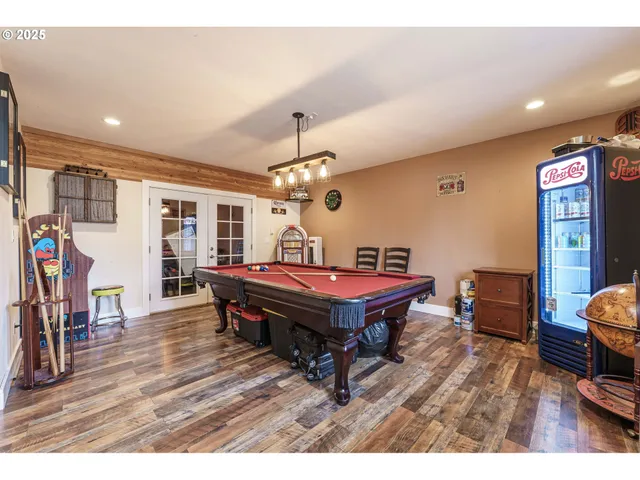 a room with furniture a wooden floor and chandelier