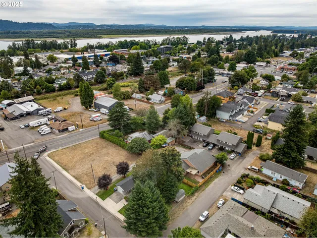 an aerial view of residential houses with outdoor space