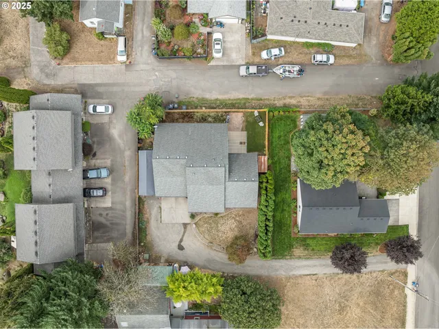 an aerial view of a house with outdoor space