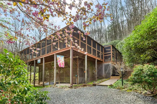 a view of a house with a tree