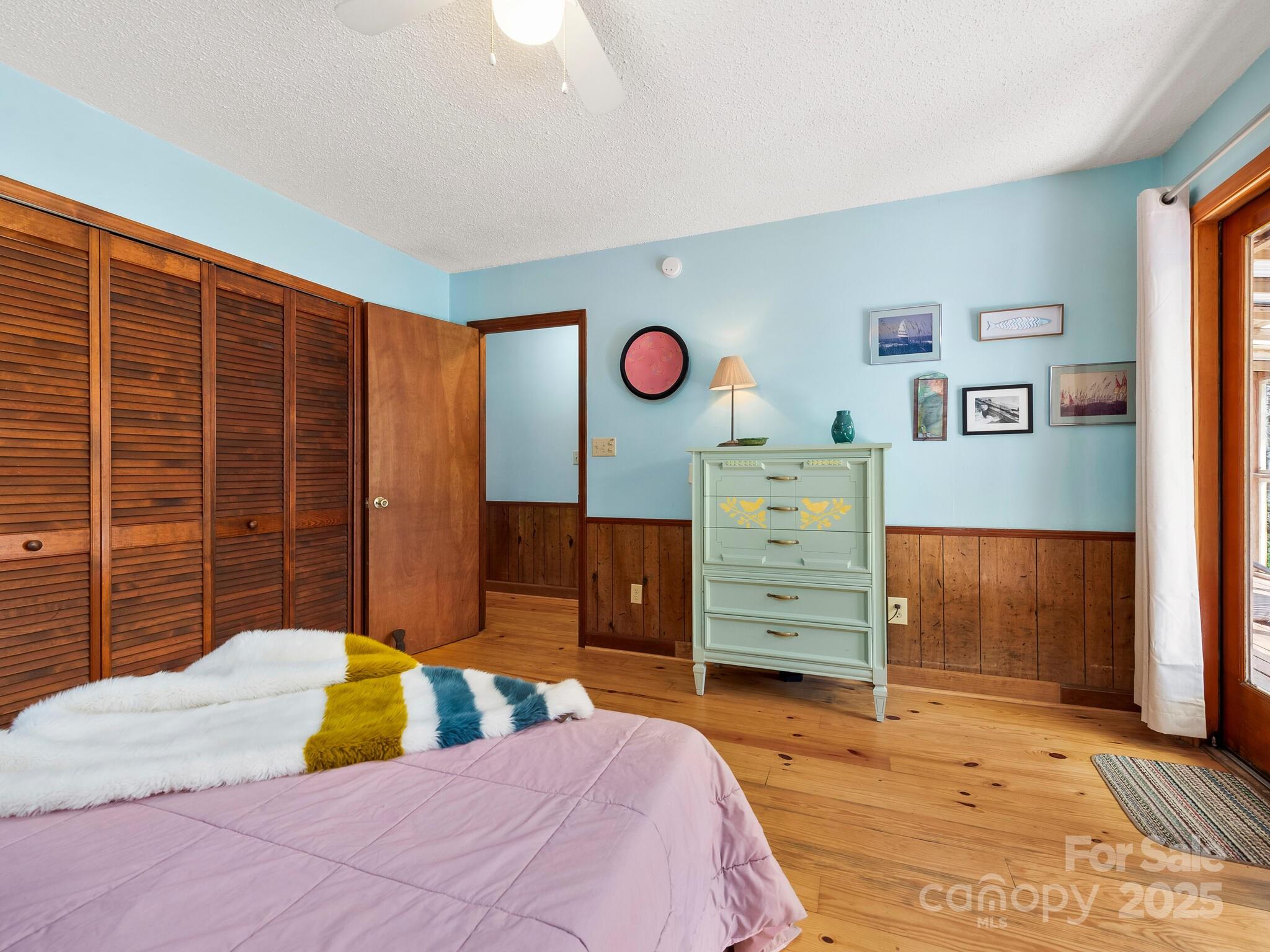 70 Fox Run Hot Springs, NC 28743 - Photo 11 of 29 a bedroom with a bed and wooden floor