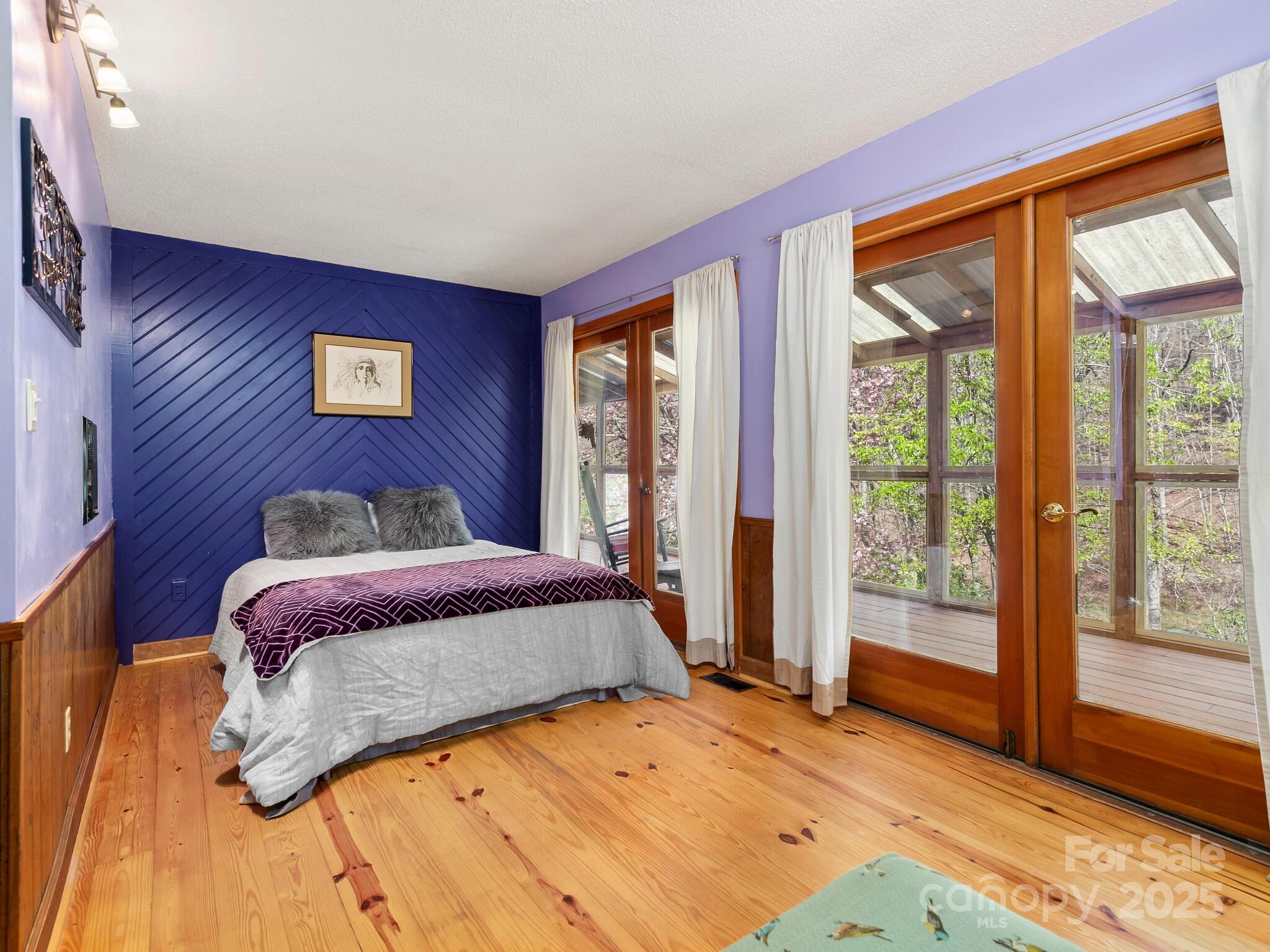 70 Fox Run Hot Springs, NC 28743 - Photo 13 of 29 a bedroom with a large bed and a large window